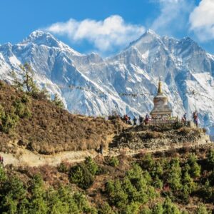 Buddhist stupa below Himalayan peaks in Nepal