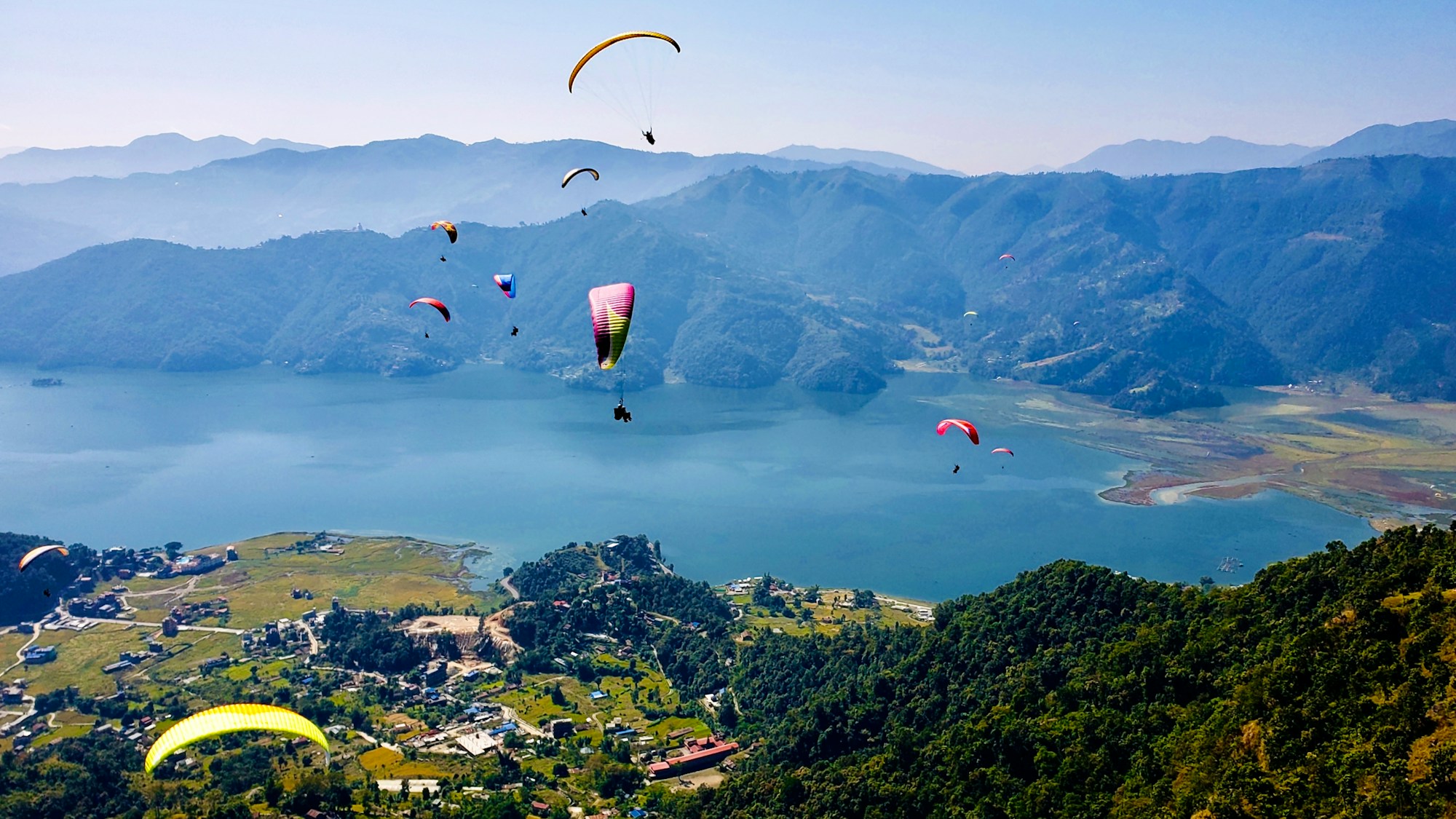 Paragliders over Phewa Lake, Pokhara, Nepal