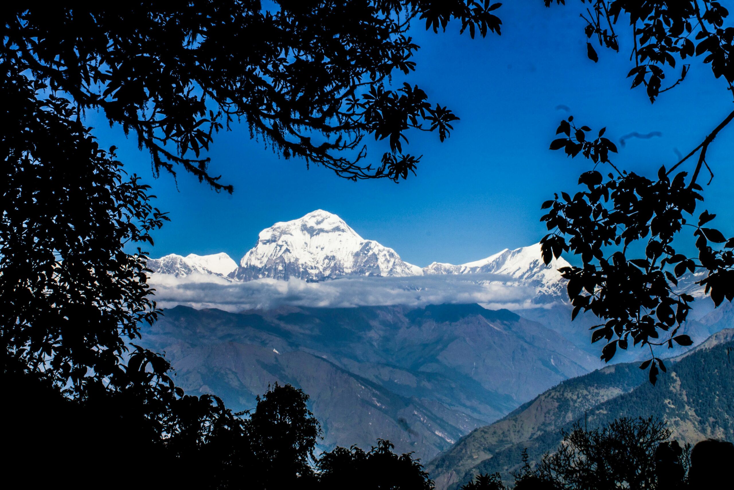 Cloud breaking over the Annapurna range seen from the Poon Hill trail, Nepal