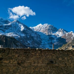 Snow-capped Himalayan peaks above a mountain pass
