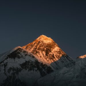 Mount Everest at sunrise, seen along the Himalayan chain