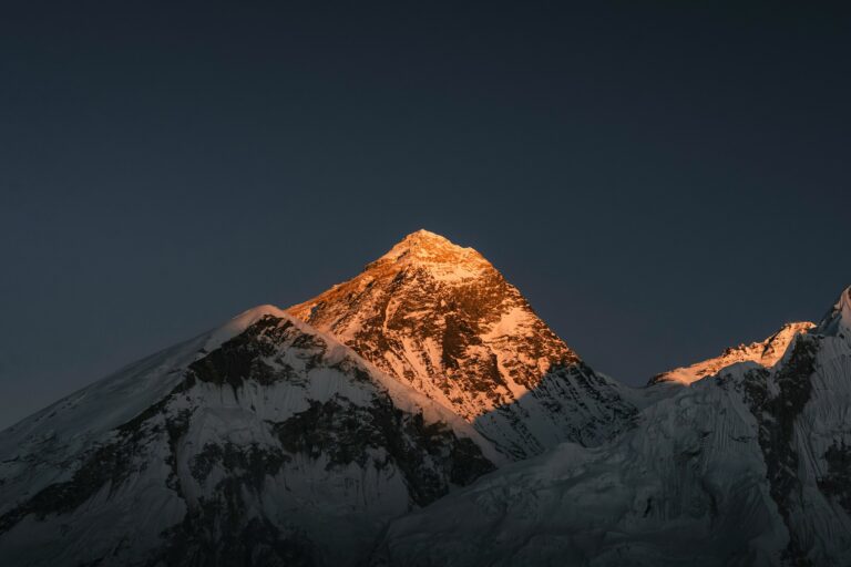 Mount Everest at sunrise, seen along the Himalayan chain